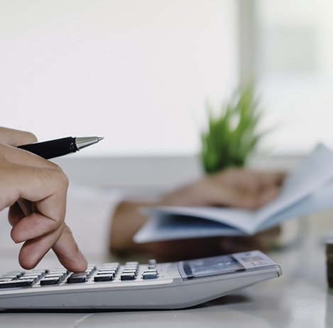 Man using a calculator